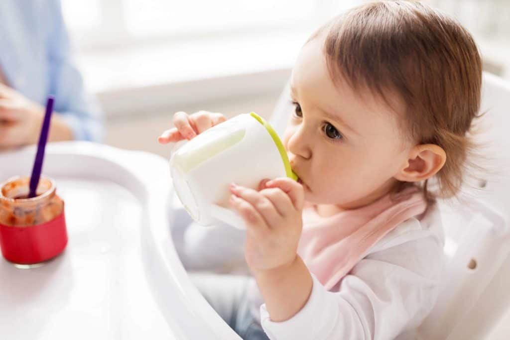 baby girl drinking from a non-toxic sippy cup