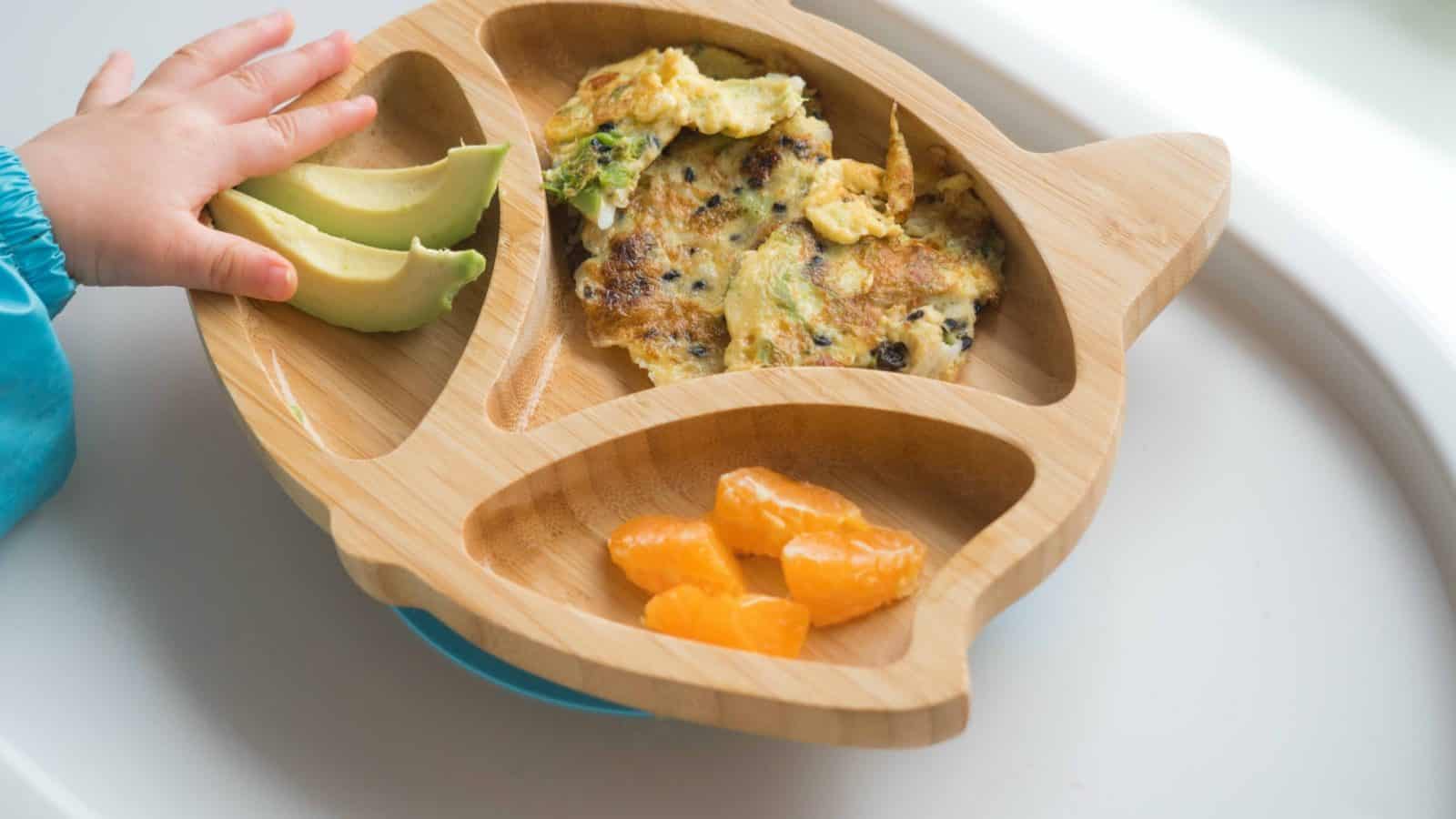 wooden toddler plate with finger foods for baby-led weaning