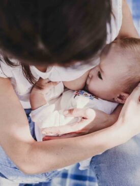 mom breastfeeding baby while in public