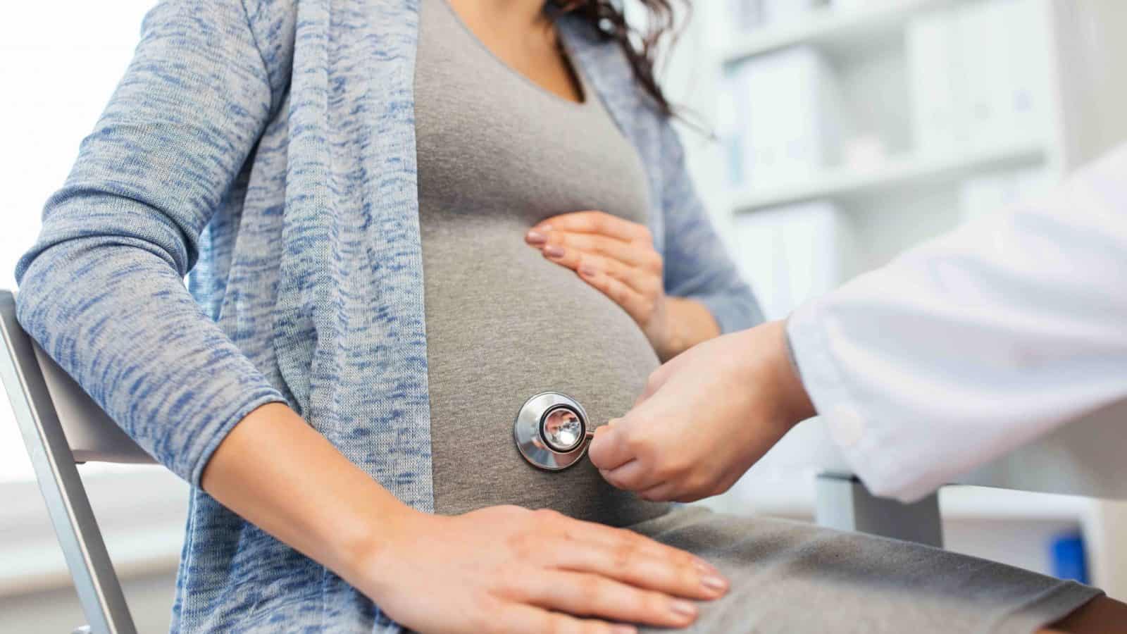 pregnant woman during doctor visit