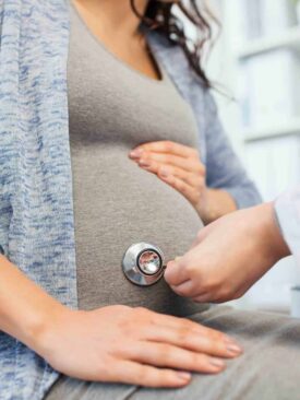 pregnant woman during doctor visit