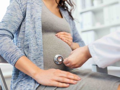 pregnant woman during doctor visit