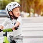 toddler on bike with helmet