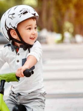 toddler on bike with helmet