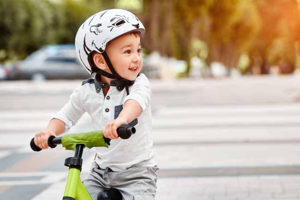 toddler on bike with helmet