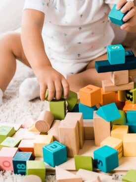 baby playing with wooden blocks