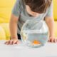non-toy gift idea for kids and toddlers - child looking at goldfish in bowl