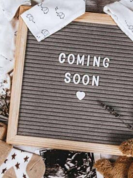 ideas for fun ways to announce pregnancy on social media with a coming soon sign