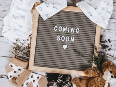 ideas for fun ways to announce pregnancy on social media with a coming soon sign