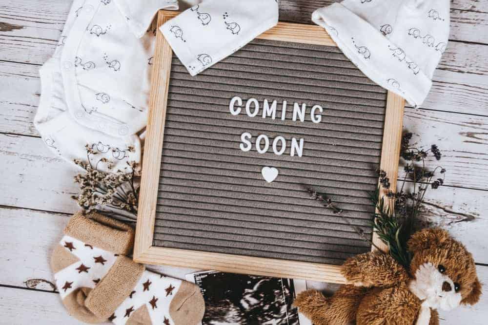 ideas for fun ways to announce pregnancy on social media with a coming soon sign