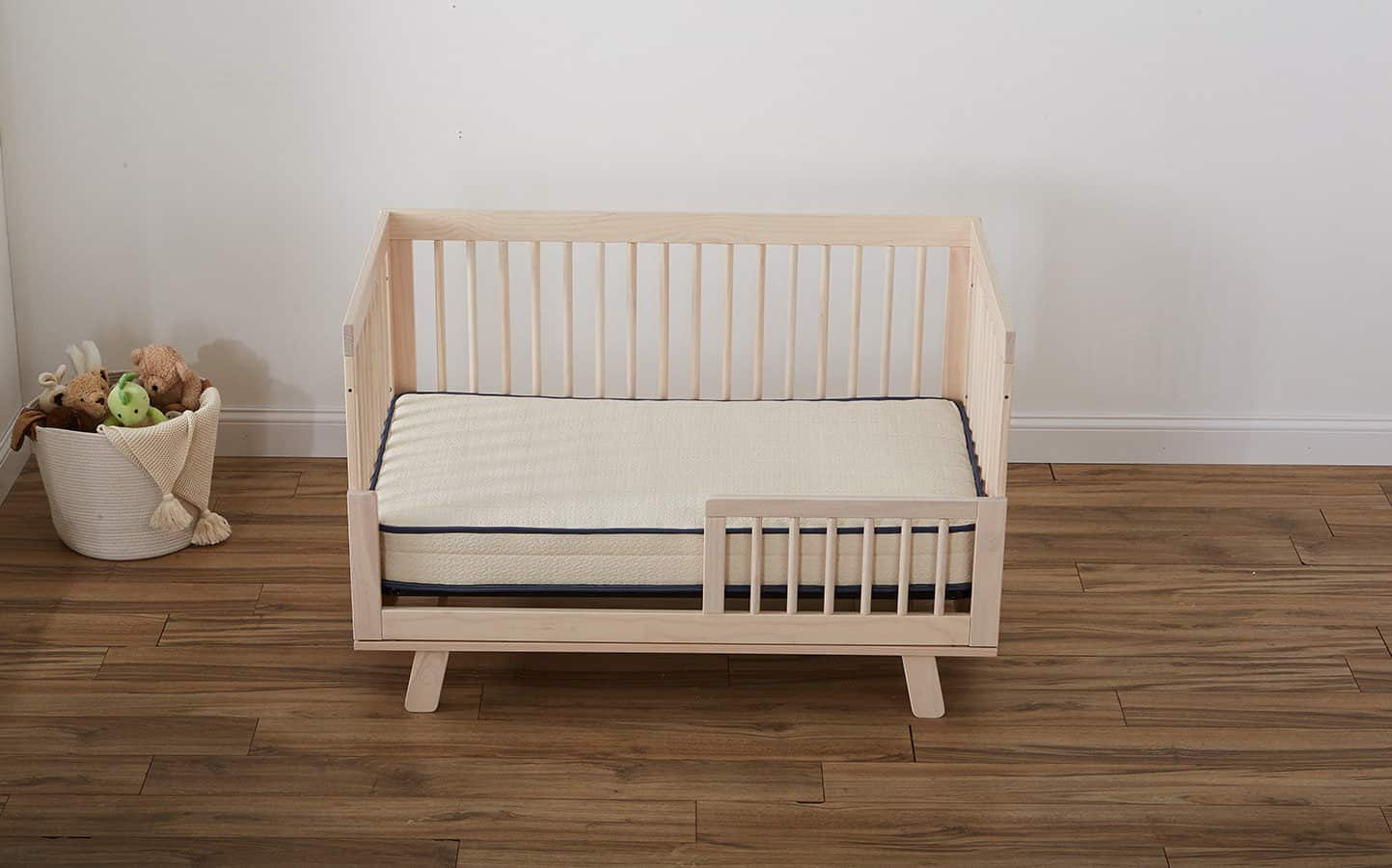 Emily organic crib mattress on wooden crib