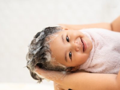 picture of cute happy baby with shampoo in hair