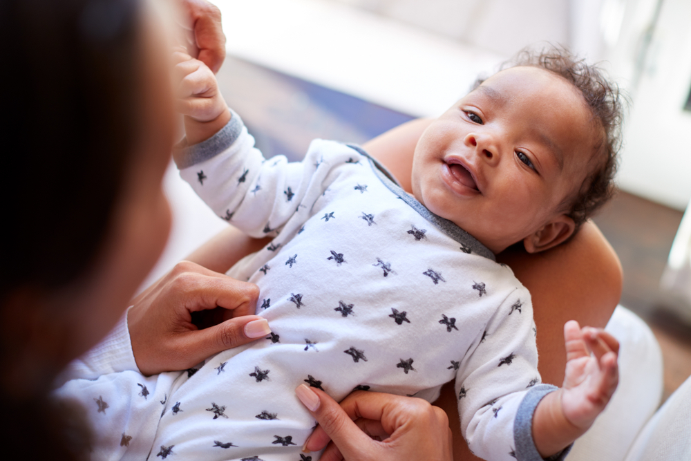 woman holding baby in her lap