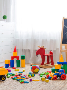 toddler playroom with lots of plastic and pvc toys