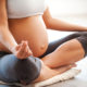 pregnant woman practicing yoga as self care during pregnancy